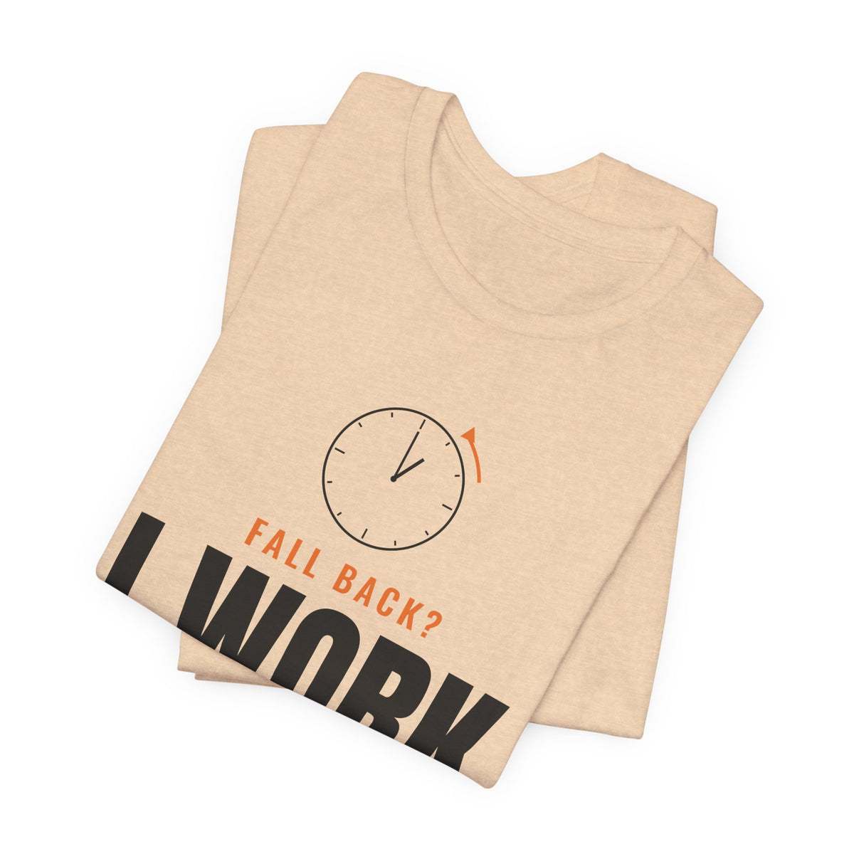 Folded natural tan t-shirt showing the oversized FALL BACK? I WORK NIGHTS clock front print
